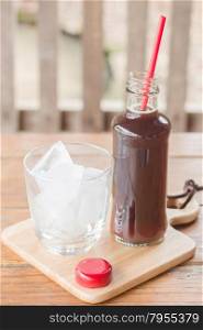 Bottle of black coffee with ice, stock photo