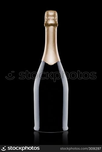 Bottle of champagne with yellow foil on blackbackground with reflection