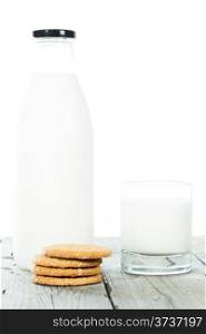 Bottle of fresh milk with cookies and with white background