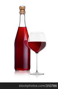 Bottle of homemade red wine and glass on white background with reflection