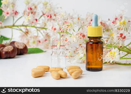 Bottle of horse chestnut extract, essence of chestnut flowers. Flowering branches and leaves of horse chestnut. Production of medicines, tablets, tinctures.. Bottle of horse chestnut extract, essence of chestnut flowers. Flowering branches and leaves of horse chestnut.