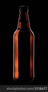 Bottle of lager beer from brown glass, isolated on a black background.