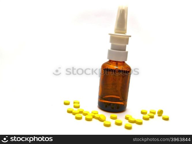 Bottle of medication and pills on white background
