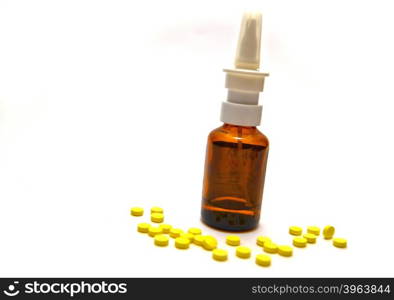 Bottle of medication and pills on white background