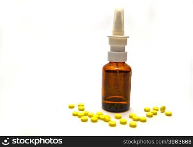 Bottle of medication and tablets on white background