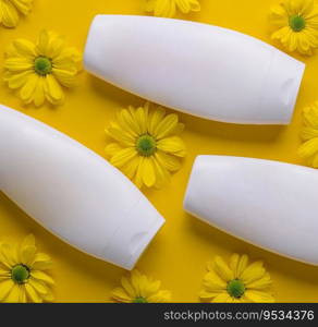 Bottle of Mockup cosmetic products with chamomile flowers