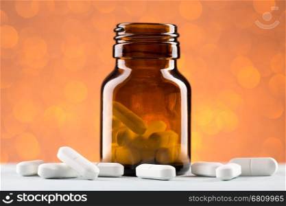 Bottle of pills from the brown glass and white tablets. Bottle of pills from the brown glass and heap white tablets