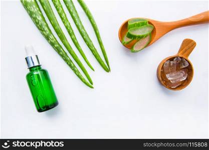 Bottle of products for spa or skin care cosmetic aloe vera gel and Aloe Vera leaves isolated on white background