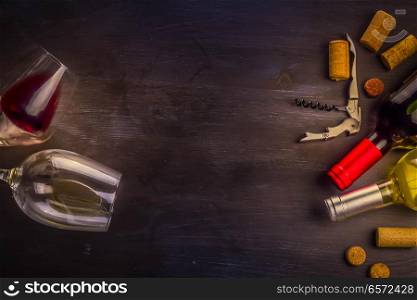 Bottle of red wine and two wine glasses on table with copy space, toned image. Glass of red wine
