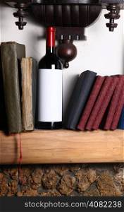 Bottle of red wine with blank label template standing on a shelf with books under an old clock