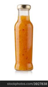 bottle of salad sauce with carrots and paprika. with clipping path