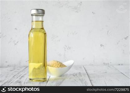 Bottle of sesame oil with sesame seeds