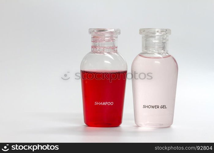 bottle of shower gel and shampoo on grey background