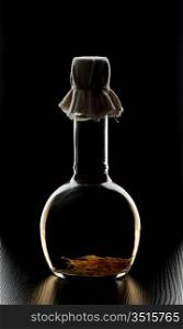 bottle of spiced by a dark background