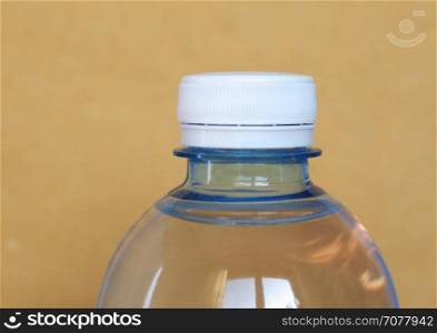 bottle of water with copy space. bottle of water over a yellow background with copy space