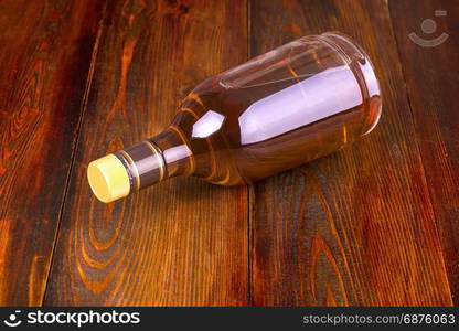 Bottle of whiskey on a wooden background