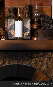 Bottle of white wine with a blank label template standing on a fireplace shelf with various vintage objects