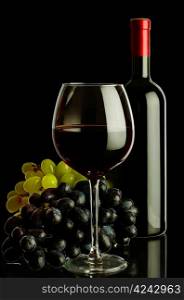 bottle of wine and grapes isolated on black background