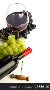 bottle of wine and grapes isolated on white background