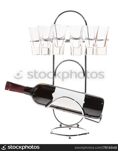bottle of wine on a metal stand with glasses on the white background