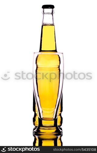 Bottle with beer and glass are distorting it on the foreground