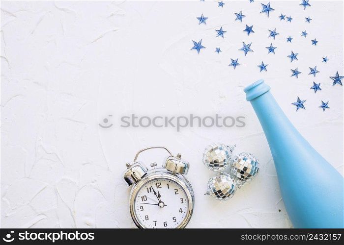 bottle with clock spangles white table