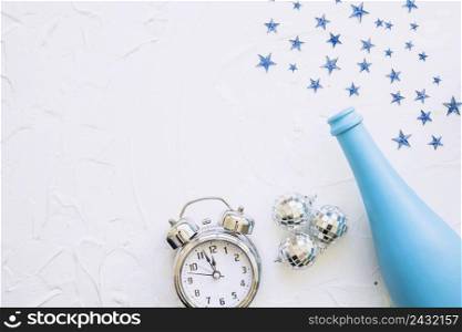 bottle with clock spangles white table
