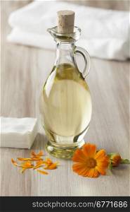 Bottle with Pot marigold oil for cosmetic use