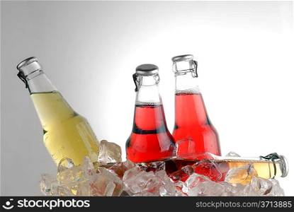 bottle with tasty drink in ice