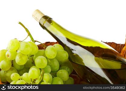 bottle with white wine and grapes