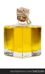 Bottle with yellow oil inside. Small closed bottle with yellow oil inside, isolated on a white background