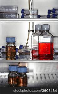 Bottles and containers in laboratory fridge