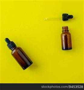 Bottles for cosmetics on a yellow background. Beauty saloon. Background with copy space. Background for advertising.