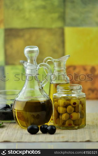 bottles of olive oil with olives