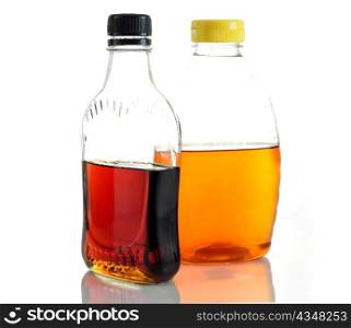 bottles with maple syrup and honey