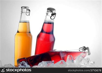 bottles with tasty drink in ice