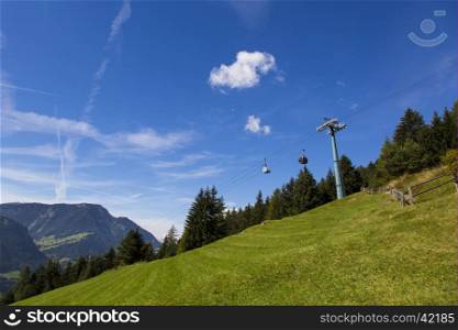 Bottom view of a cableway in a sunny day in Seiser Alm