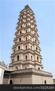 Bottom view of a historic pagoda in China against blue sky