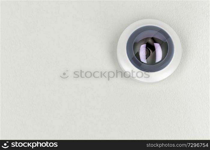 Bottom view of cctv camera on white ceiling