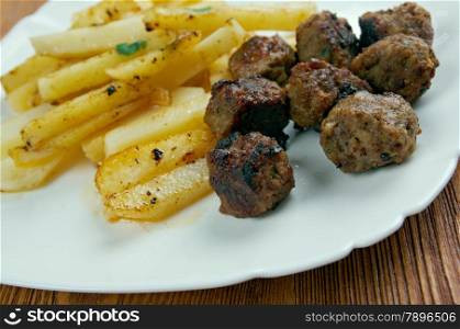 Boulet a la liegeoise - meatballs with sauce and french fries.