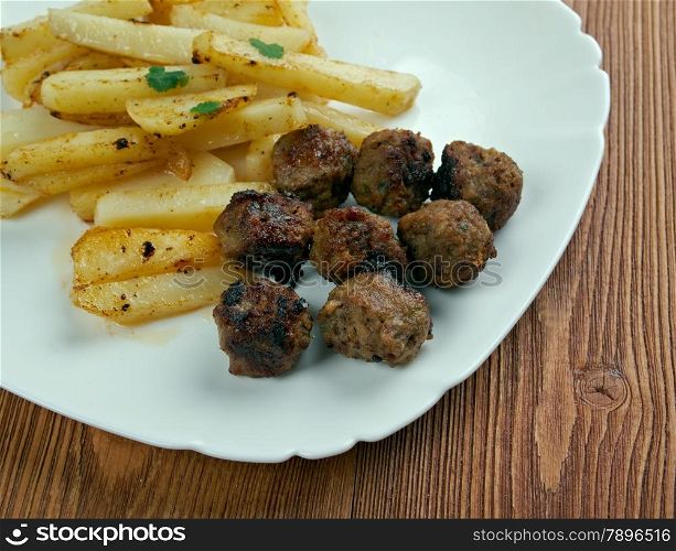 Boulet a la liegeoise - meatballs with sauce and french fries.