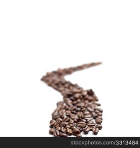 bounch of roasted coffee beans mimic a road shape