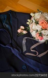 Bouquet and attire of the bride and groom before the wedding.. Elements of jewelry of the bride and grooms attire 3896.