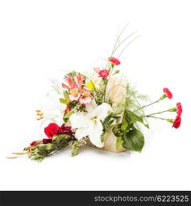 Bouquet from mixed colorful flowers in basket isolated on white. Ikebana isolated on white