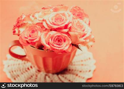 Bouquet of beautiful fresh pink roses in pink cup. Pink roses in pink pot