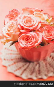 Bouquet of beautiful fresh pink roses in pink cup. Pink roses in pink pot