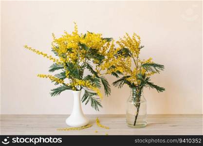 Bouquet of beautiful fresh yellow mimosa in vase. Holidays, Valentine&rsquo;s Day or Mom&rsquo;s Day concept.