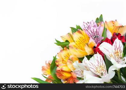Bouquet of colorful flowers alstroemeria on white background. Flat lay. Horizontal. Mockup with copy space for greeting card, social media, flower delivery, Mother?s day, Women?s Day