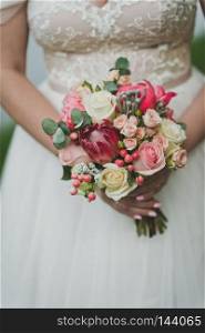 Bouquet of flowers from the hands of the bride.. Bouquet in hands of bride 9256.