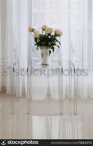 Bouquet of flowers on a chair in modern flat
